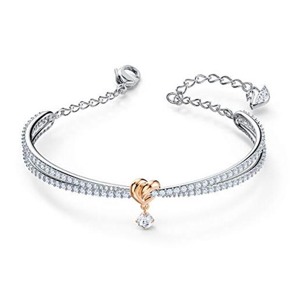 Découvrez l'élégance du bracelet jonc cœur Swarovski Lifelong Heart : un accessoire raffiné alliant design intemporel et éclat cristallin pour sublimer vos tenues.